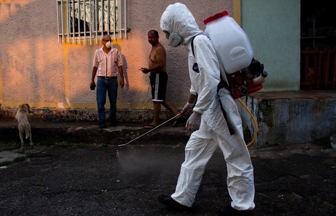 Pest control professional spraying treatment